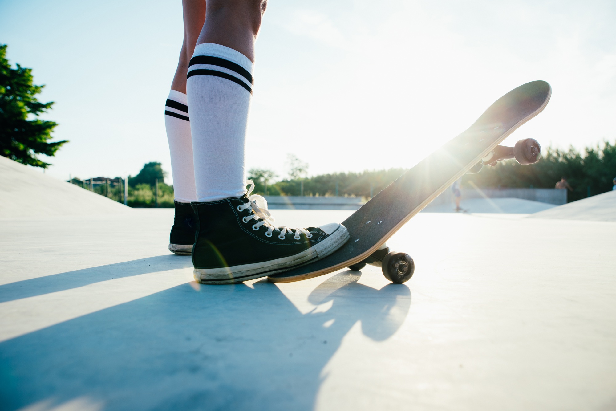 Beautiful skater girl lifestyle moments in a skatepark